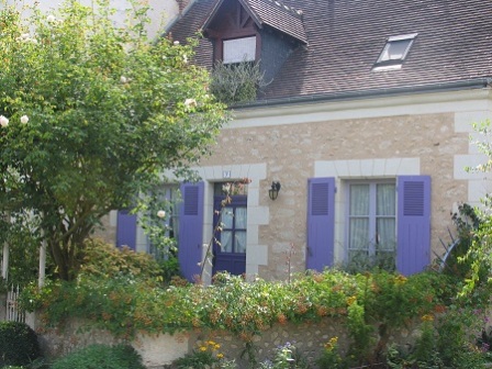 House in Chedigny in Centre-Val de Loire France with violet shutters