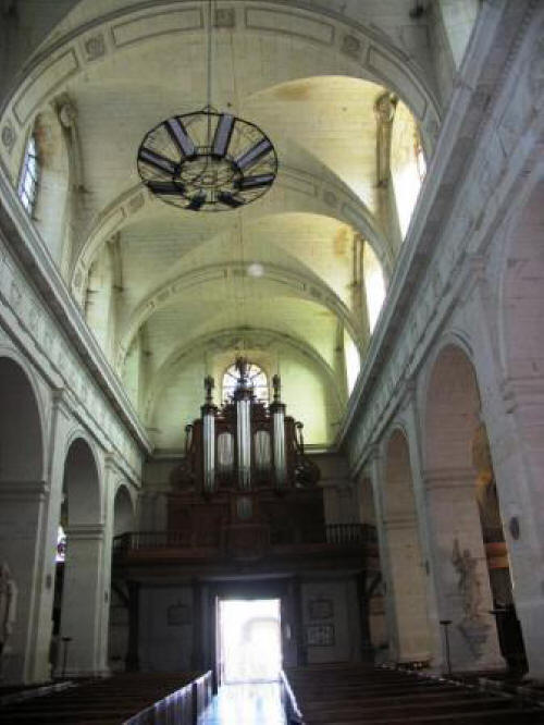 looking towards the exit and organ of the church of Notre Dame de Richelieu in the Loire Valley