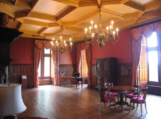 Red sitting room of Chateau de Cande in the Loire Valley,France